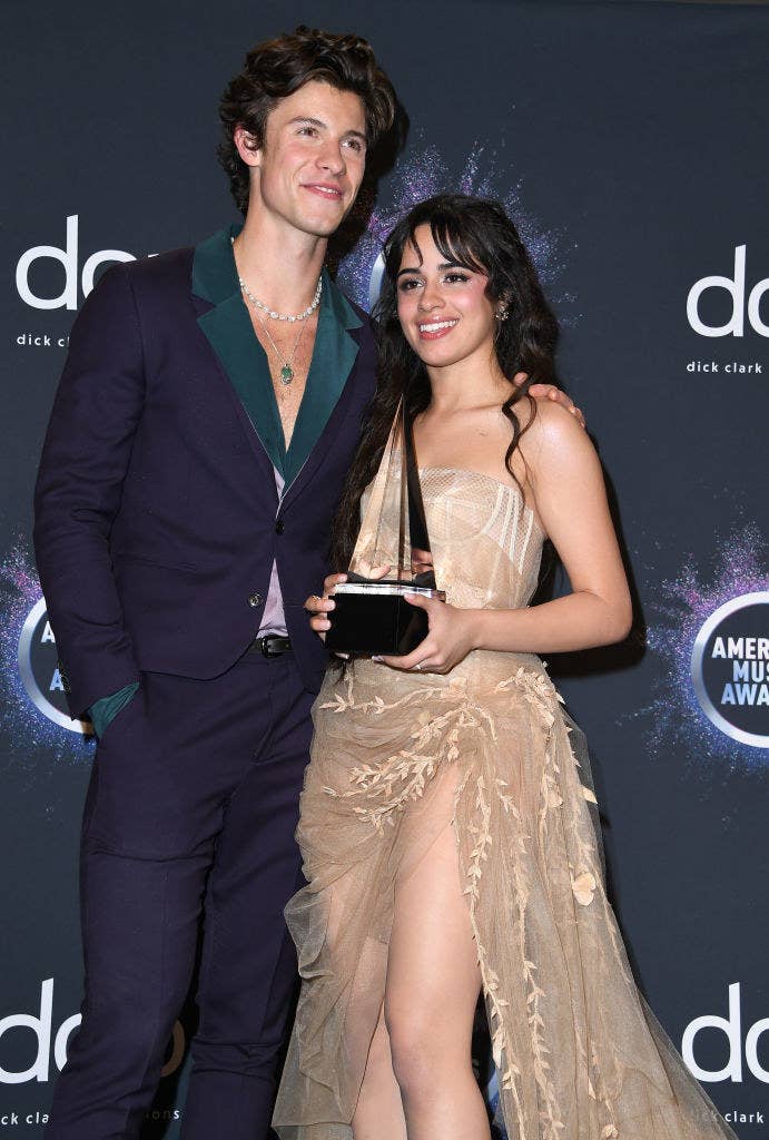 Shawn and Camila share a laugh on the carpet of the AMAs