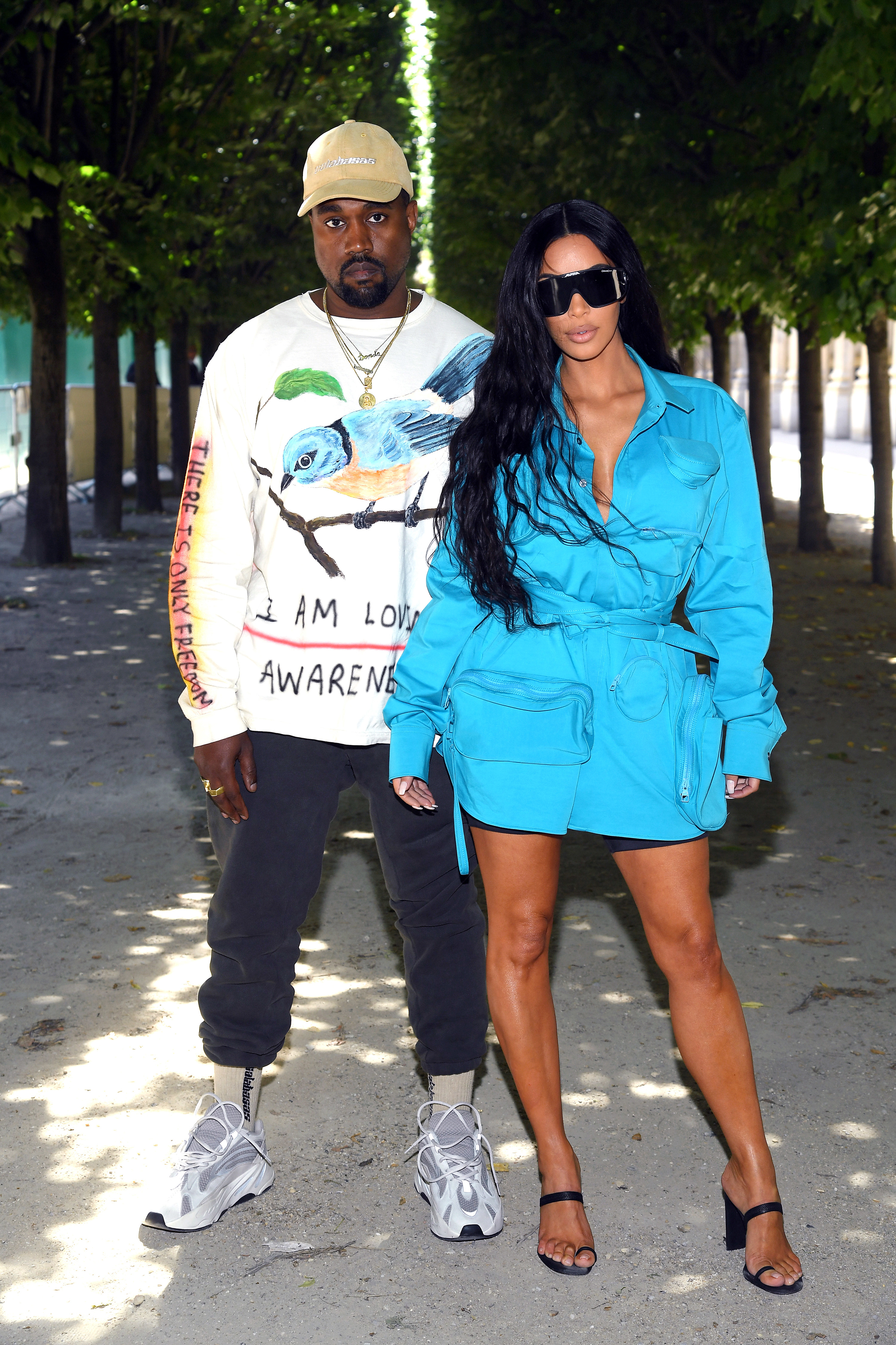 Ye and Kim standing together outside