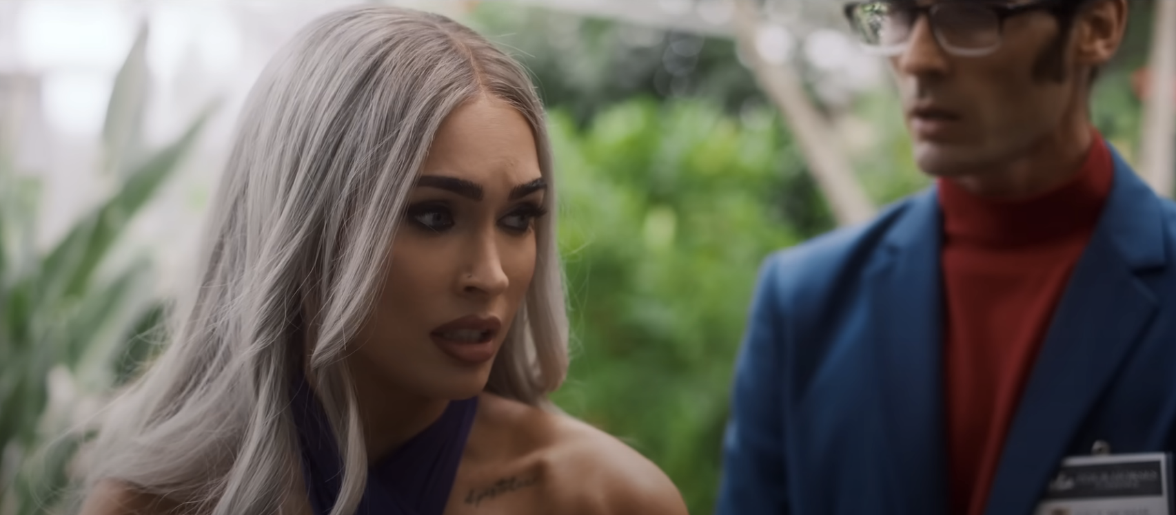 Megan's character looks concerned as Tyson's character stands behind her