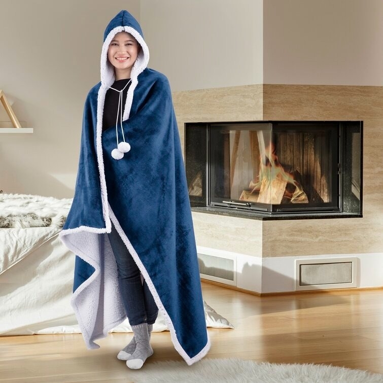 A model wears a hooded blanket