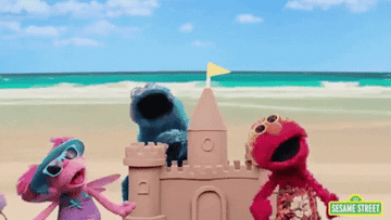 cookie monster, elmo, and Abby Cadabby singing on the beach in &quot;sesame street&quot;