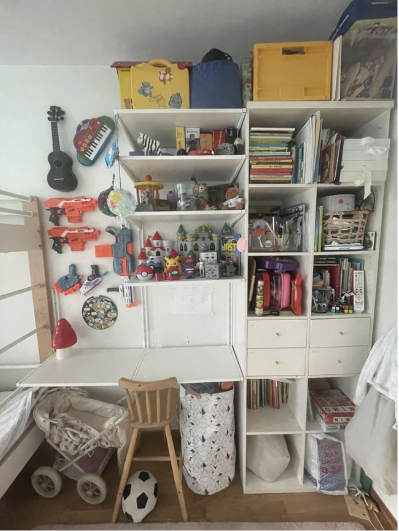 A child&#x27;s desk with many items on it, but they&#x27;re neatly arranged in cubbyholes