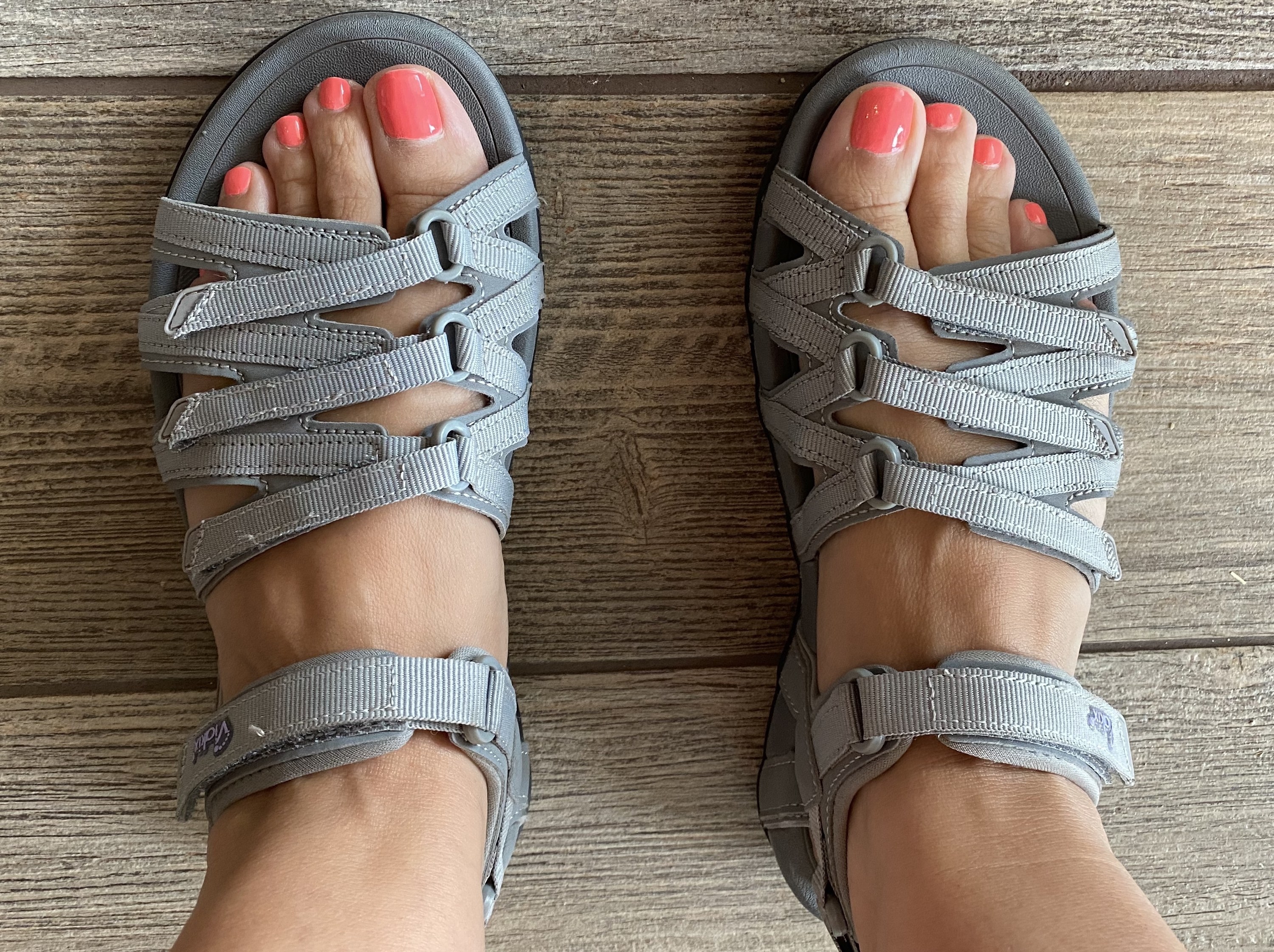 A reviewer wearing grey sandals