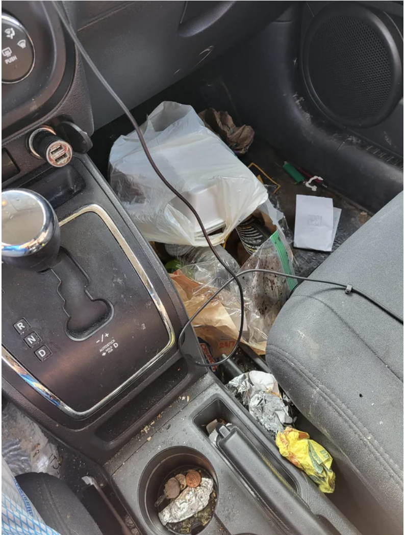 The very interior of a car&#x27;s front seat