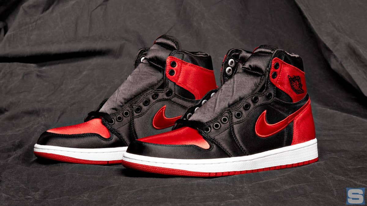 Jordan Brand is reportedly releasing the original black-and-red ("Bred") Air Jordan 1 in satin form for women in October 2023. Click for the release info.
