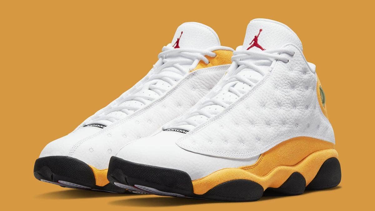 The 'White/University Red/Del Sol/Black' Air Jordan 13 will release in March 2022 for $200. Click for full release date info, images, and more details.