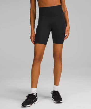 black long running shorts on a model