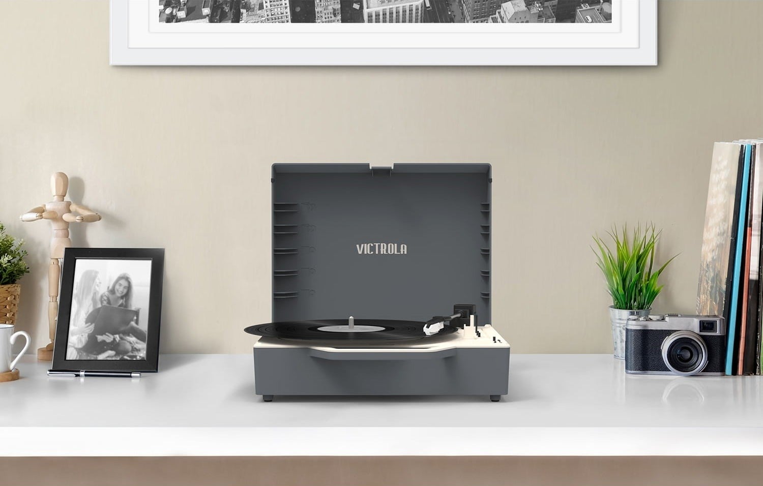 Dark gray record player on white countertop