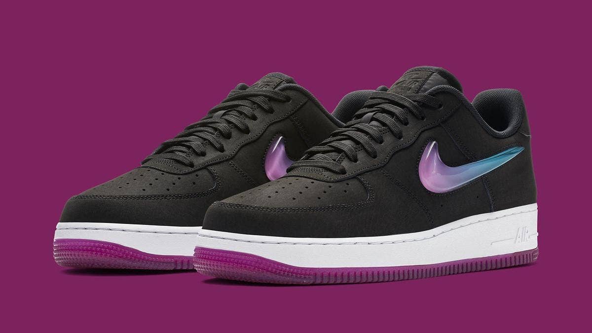 The latest colorway of the Nike Air Force 1 Low features a black nubuck upper, gradient-filled jewel Swooshes, and a translucent fuchsia bottom.