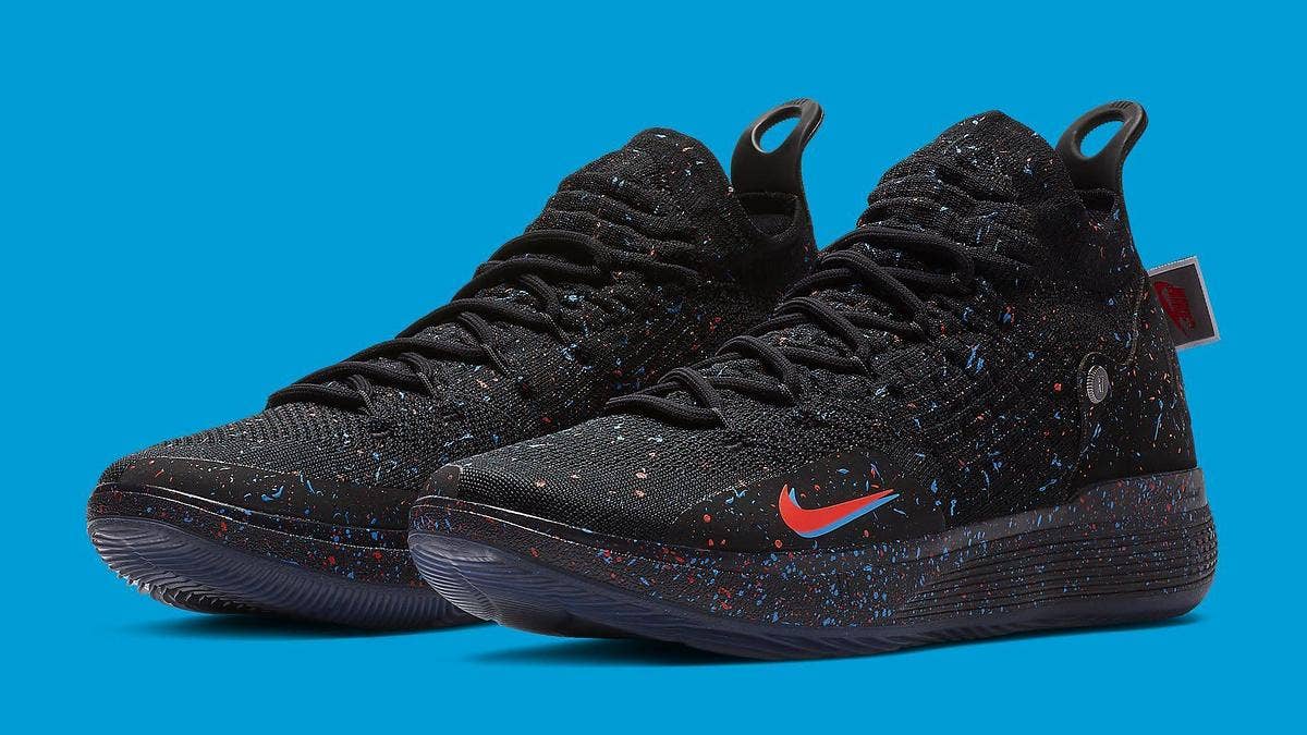 Photos have surfaced of a 'Just Do It' colorway of the Nike KD 11. The pair covers a black upper in a bright red and blue splatter print. 