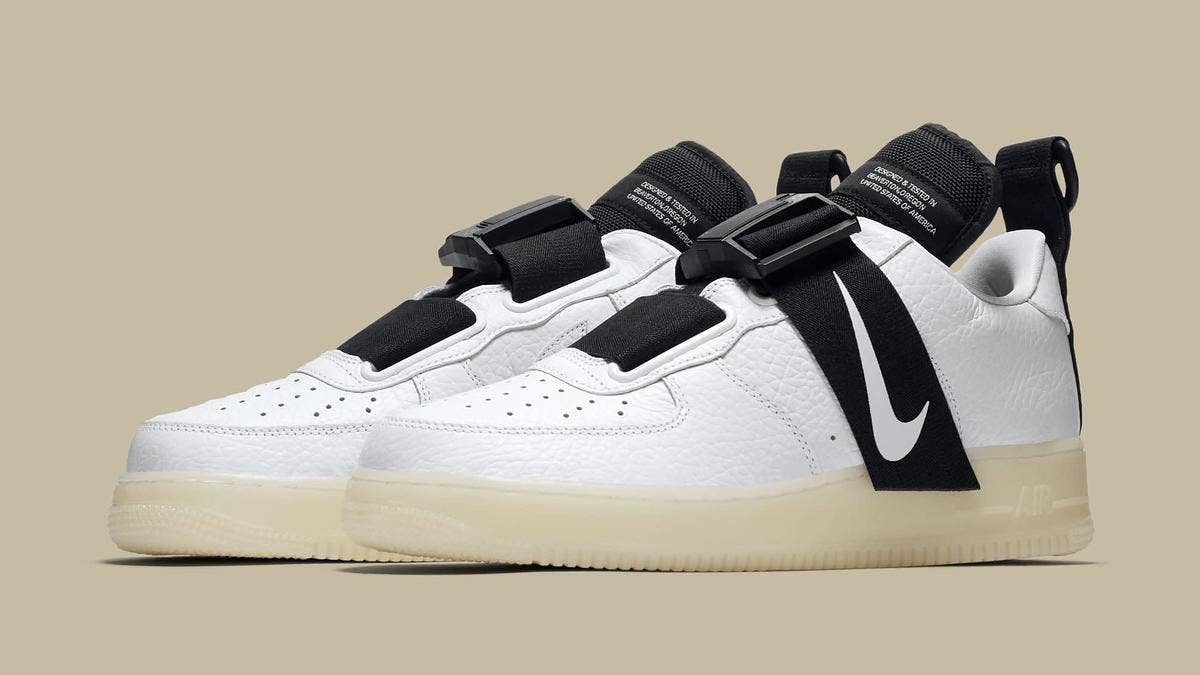 An upcoming Nike Air Force 1 Utility QS features a glow in the dark midsole and a forefoot strap. The sneaker also features a mostly white leather upper.