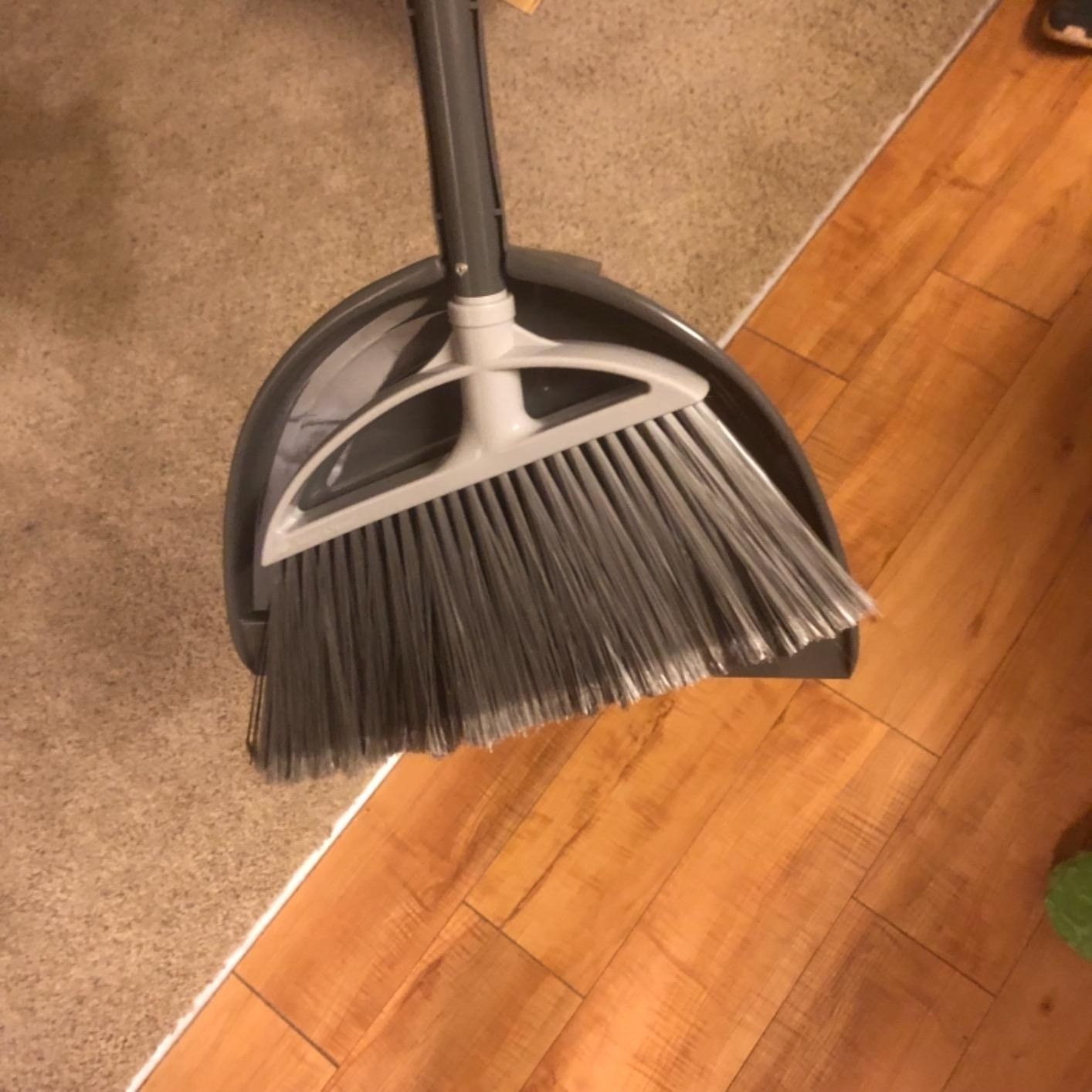 a reviewer photo of the gray broom and dustpan