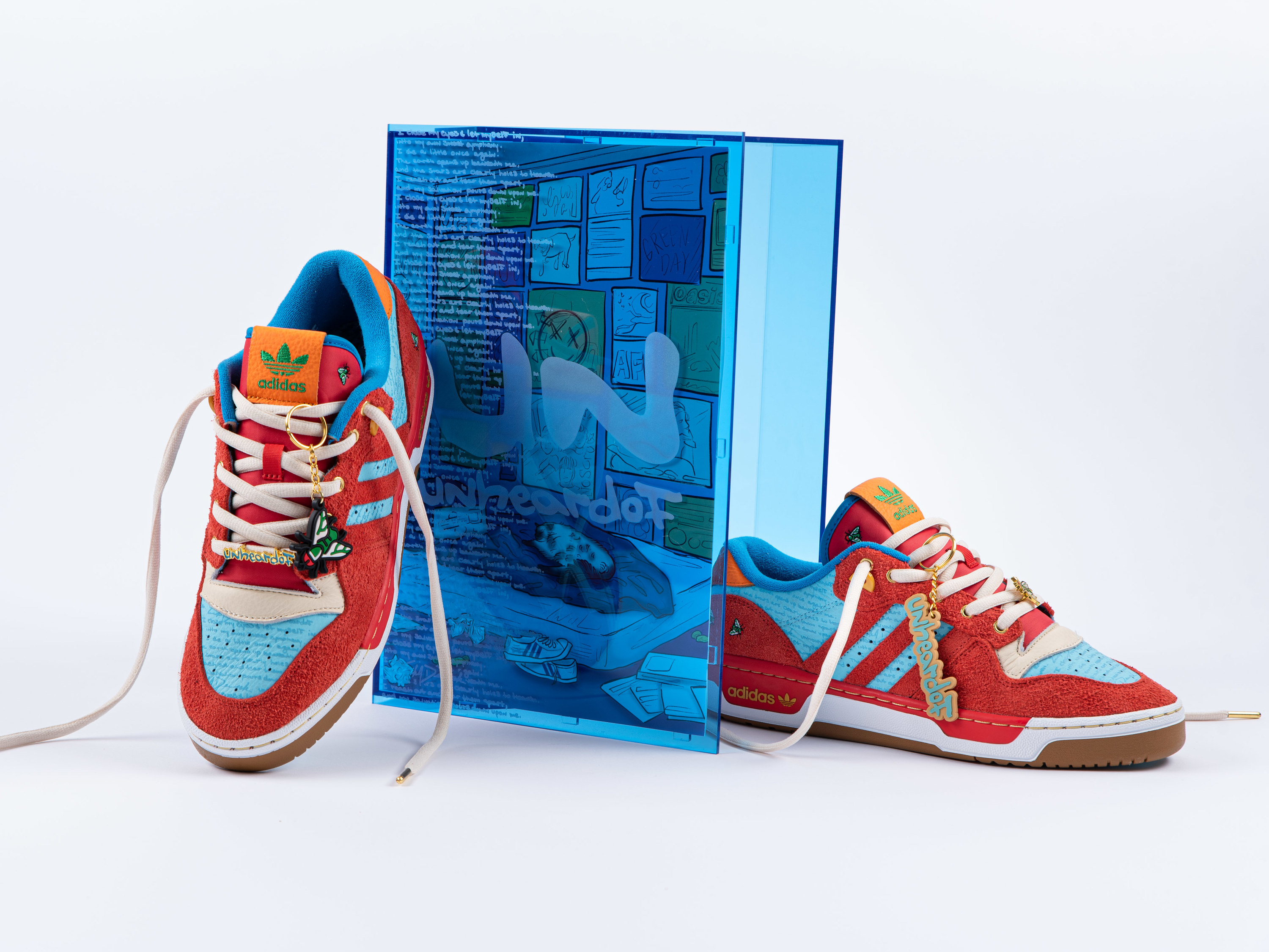 The blue acrylic box for the Unheardof x Adidas Rivalry Low ‘Erika’s Poem’