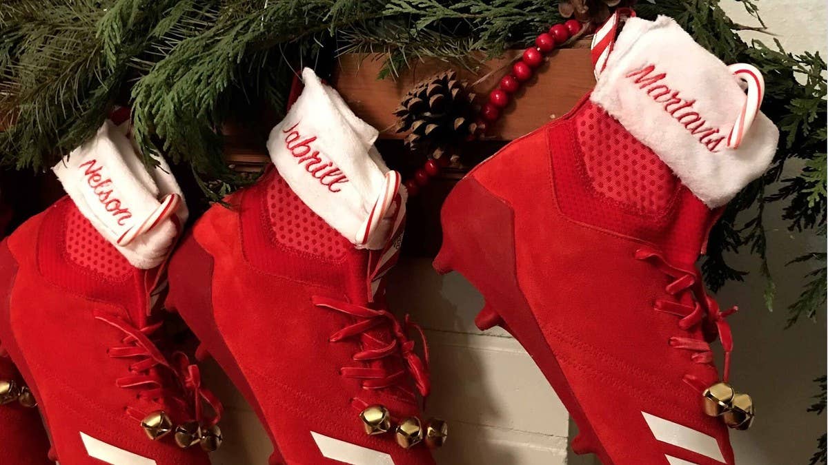 Adidas' football athletes have the most appropriate custom cleats for this week's Christmas games.