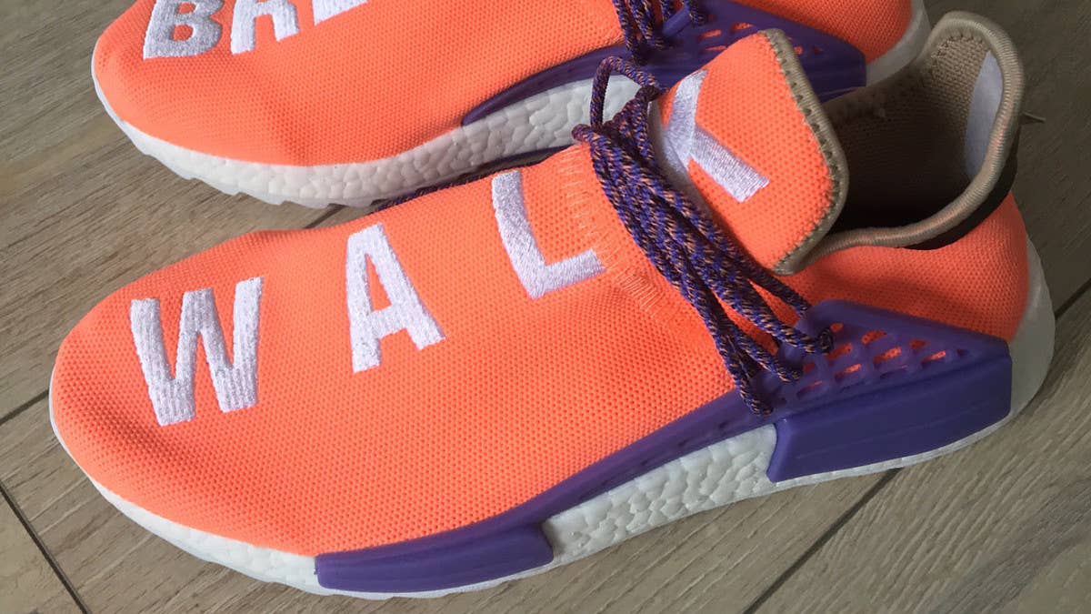 The Pharrell-designed Adidas NMD Hu surfaces in orange and purple.