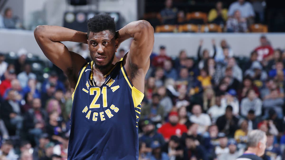 Thaddeus Young rips his Nike NBA jersey at the collar.