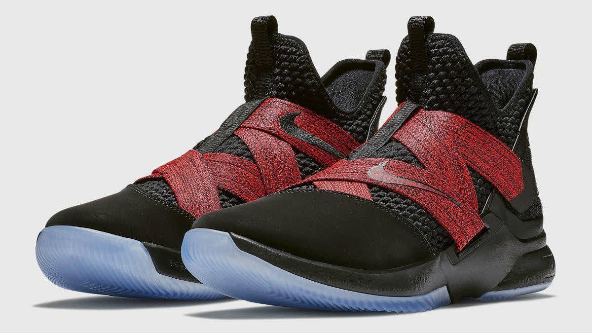 A staple look in LeBron James' signature sneaker line, the 'Bred' Nike LeBron 12 features a black suede and Battleknit upper, wrapped by printed red cross-straps.