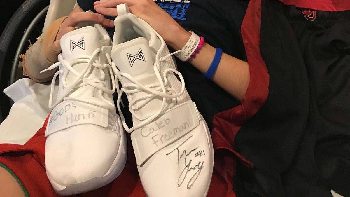 Trae Young gives 22-assist game sneakers to a young fan injured in a car wreck while driving to see him play.