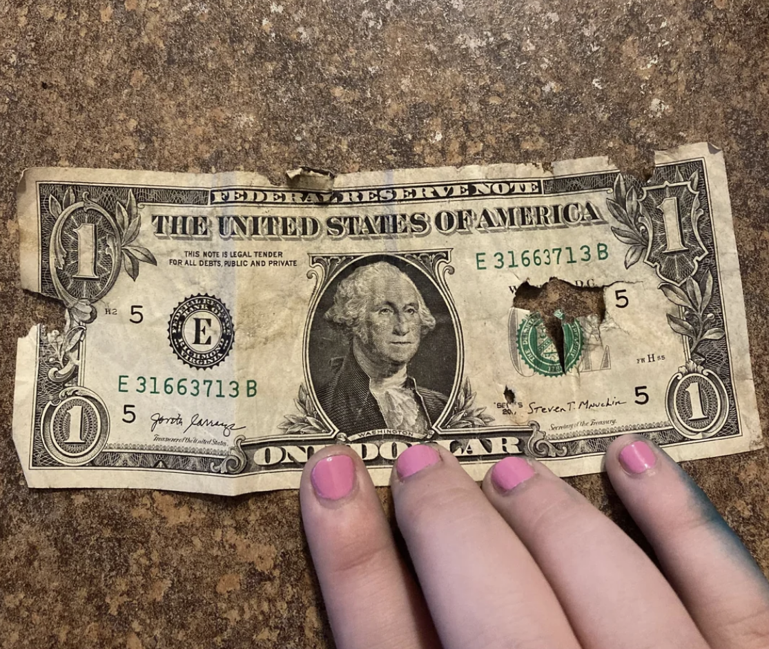 A ripped dollar bill