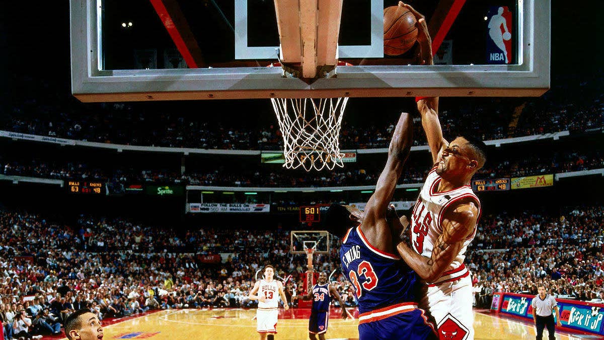 A silhouette of Scottie Pippen's poster dunk on Patrick Ewing appears on these Nike Air More Uptempos.