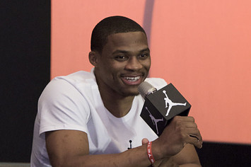 Russell Westbrook holding microphone