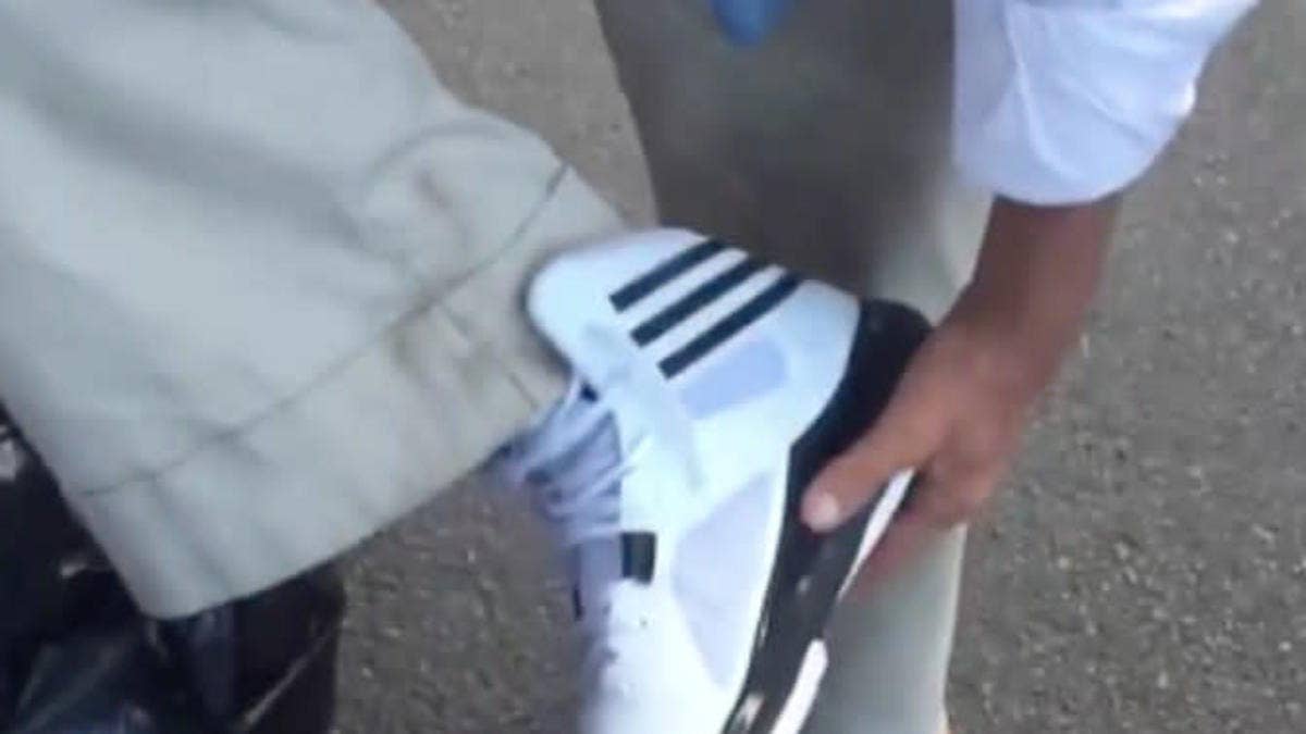 Man gives a homeless veteran a brand new pair of Adidas basketball sneakers off his feet.