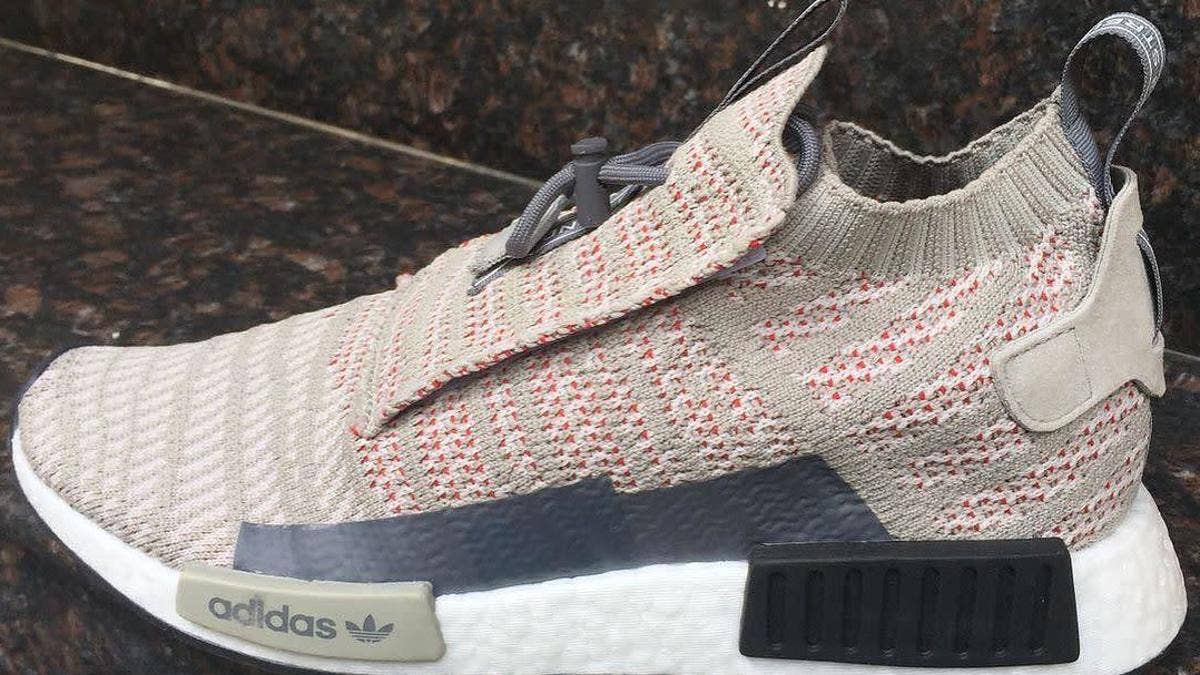 A velcro lace cover highlights the new Adidas NMD_TS1.