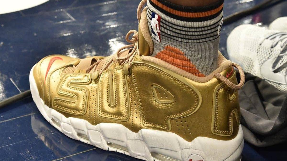An unexpected debut for the gold-based Supreme x Nike Air More Uptempo in the Dunk Contest.