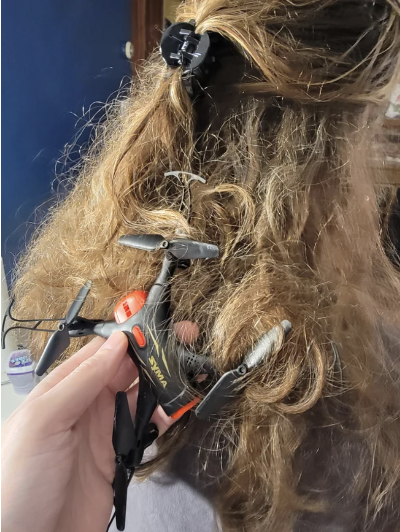 A small drone stuck in someone&#x27;s hair