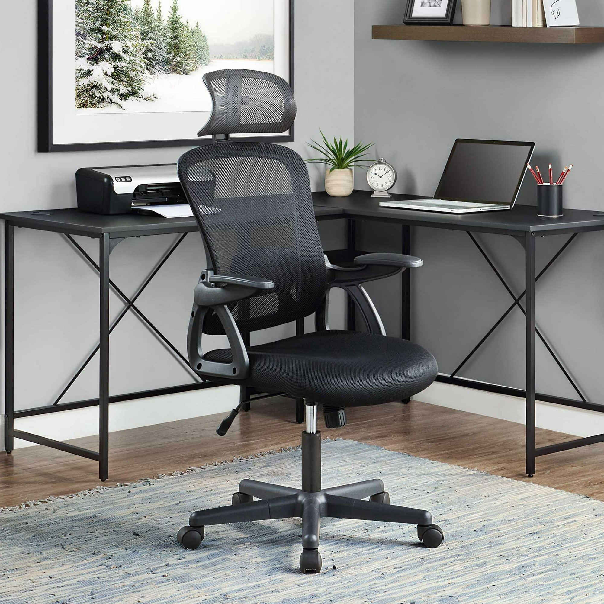 the black swivel chair in front of a desk