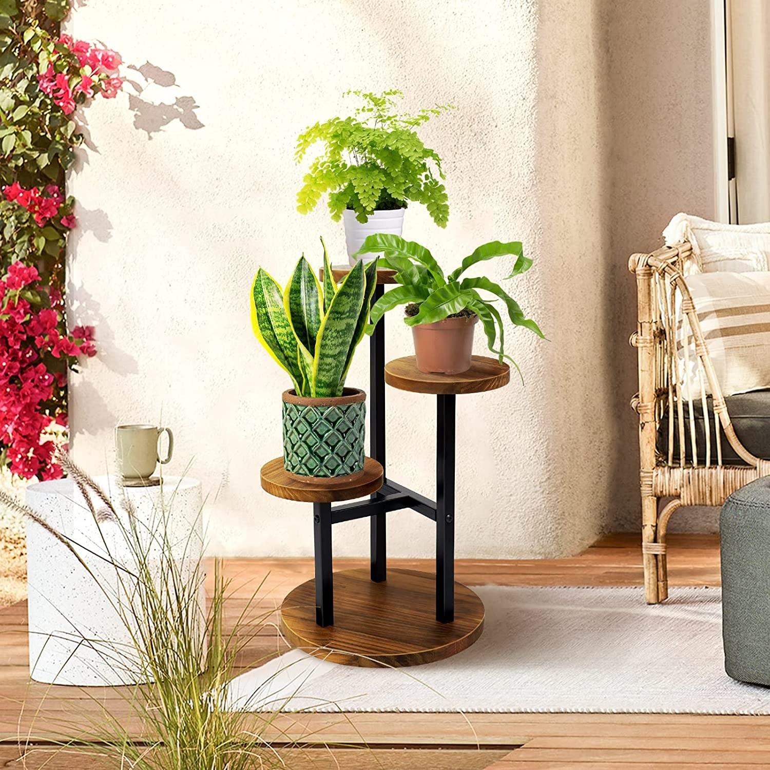The plant stand with three plants on each tier