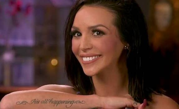A screencap of Scheana Marie displaying her &quot;It&#x27;s All Happening&quot; arm tattoo