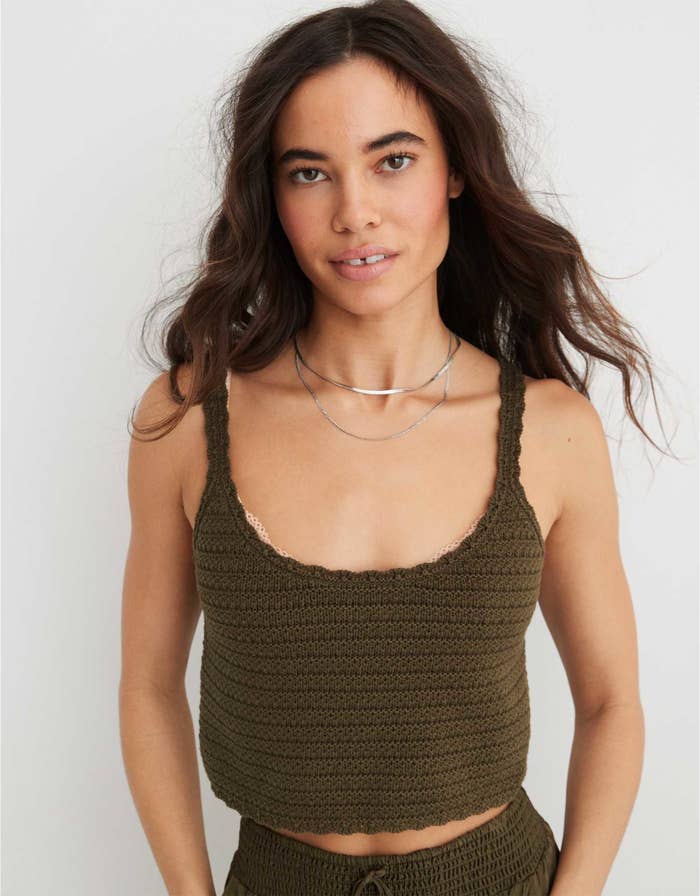 model in olive green cropped crocheted tank top
