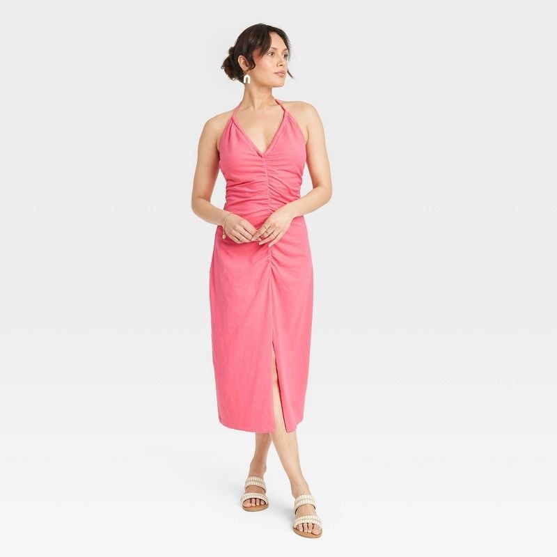 A model wearing a pink dress