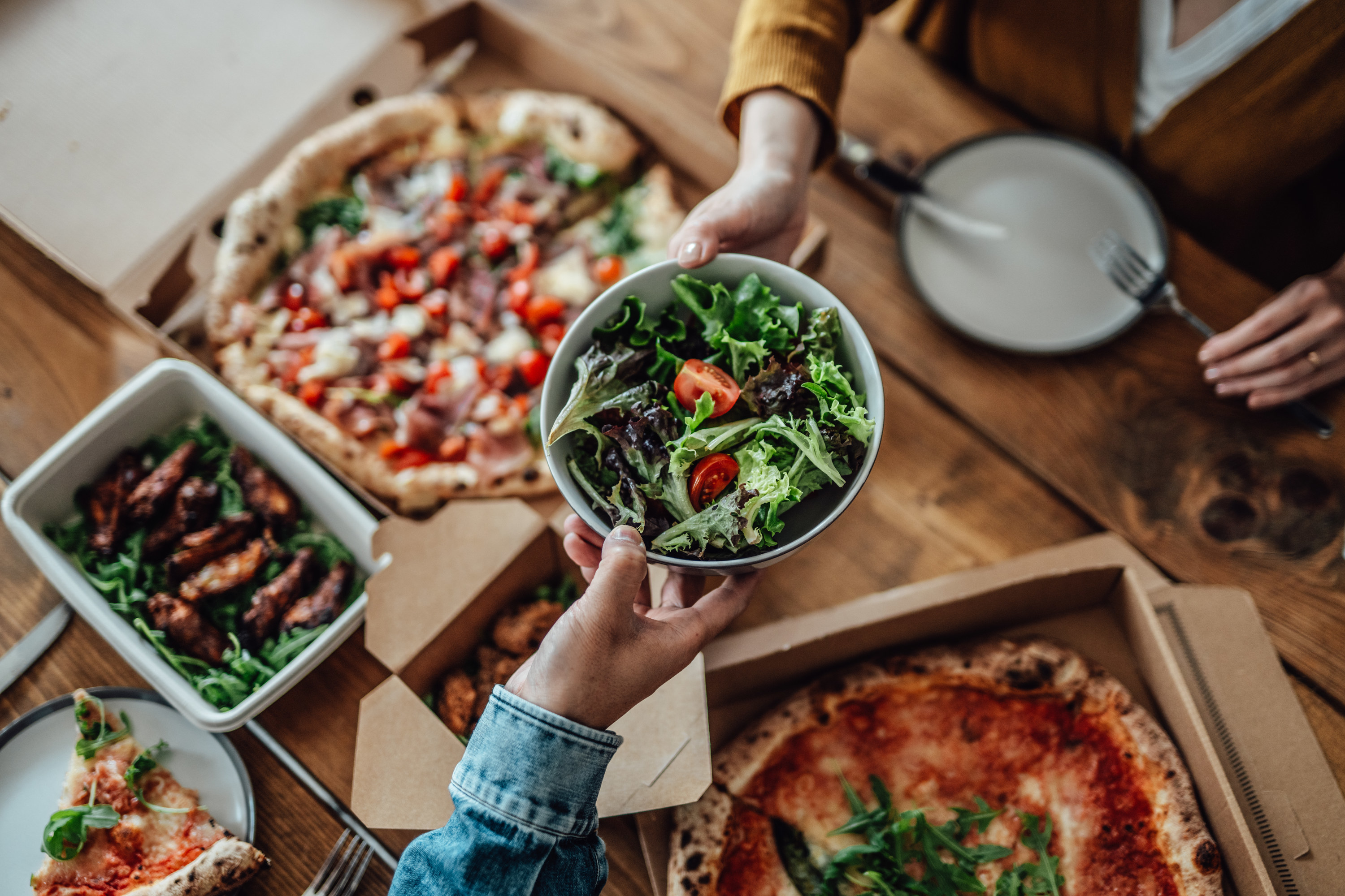 two people eating takeout