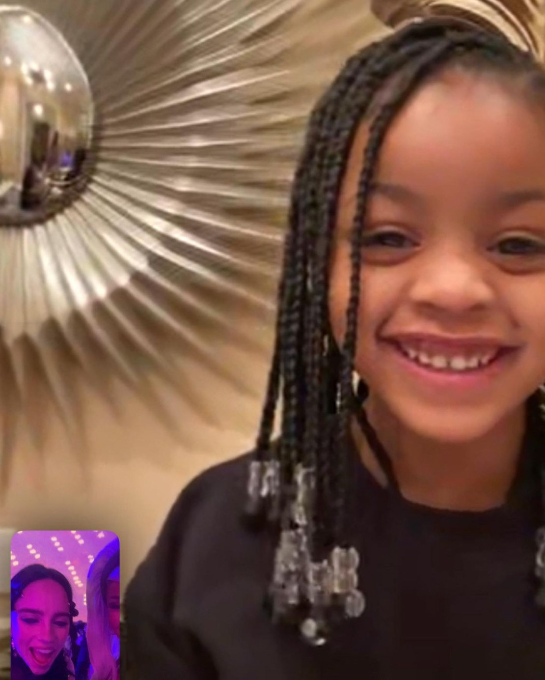 A screenshot of a little girl smiling on a Facetime call and in the corner Billie can be seen talking