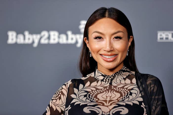 Closeup of Jeannie Mai Jenkins smiling at a red carpet event