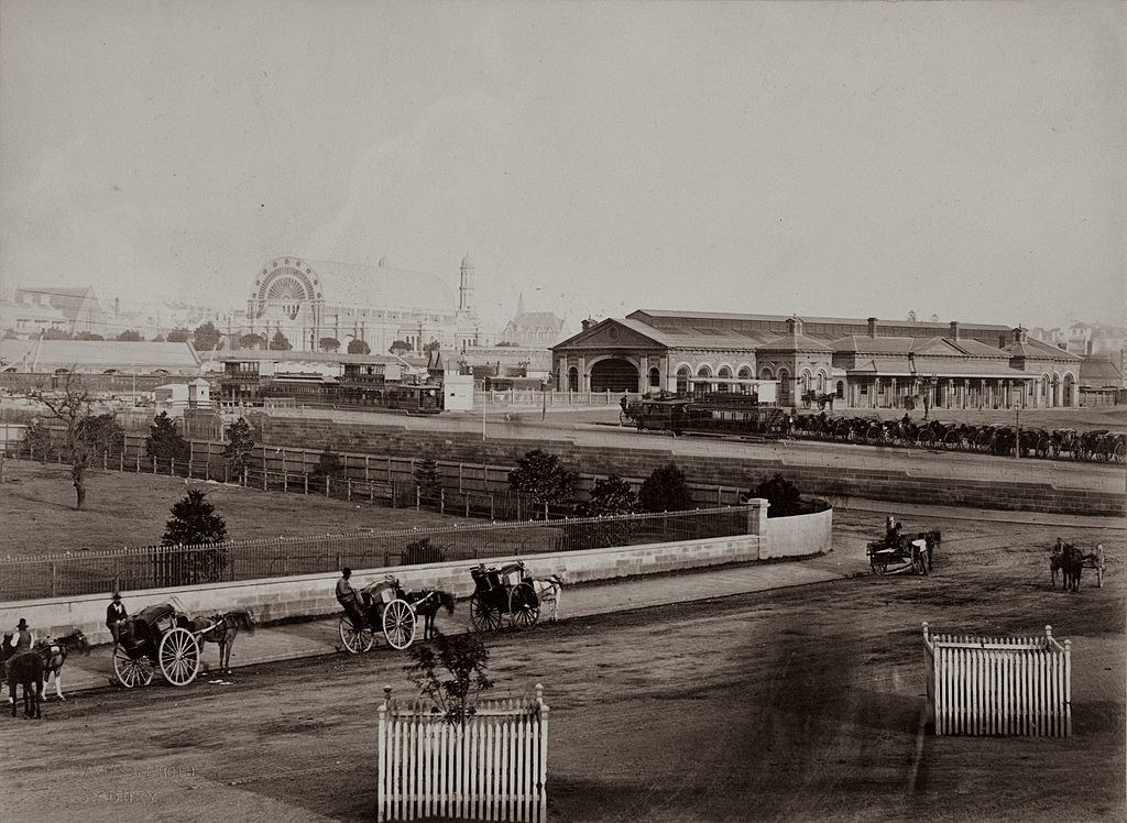 Sydney in the 1800s with horse and buggies roaming the dirt roads
