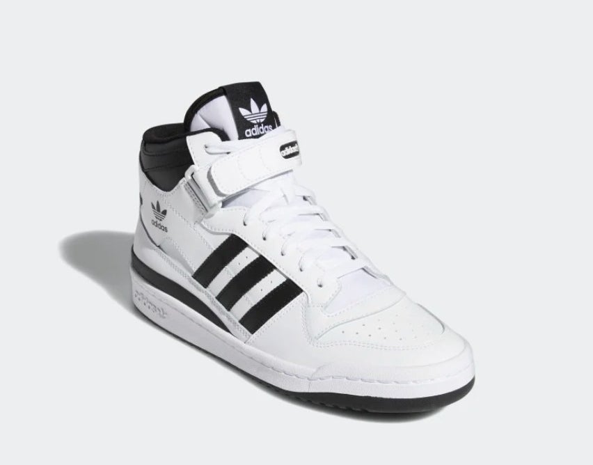 A black and white mid top shoe