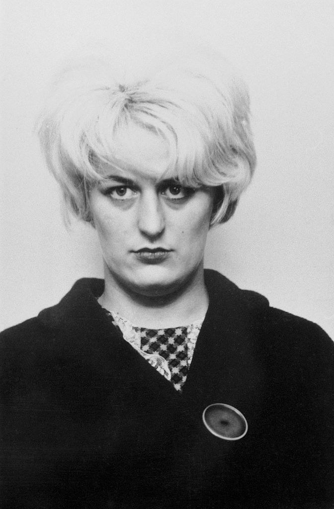 mugshot of Myra with very short blonde hair