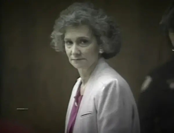 Blanche in court with short, wavy hair