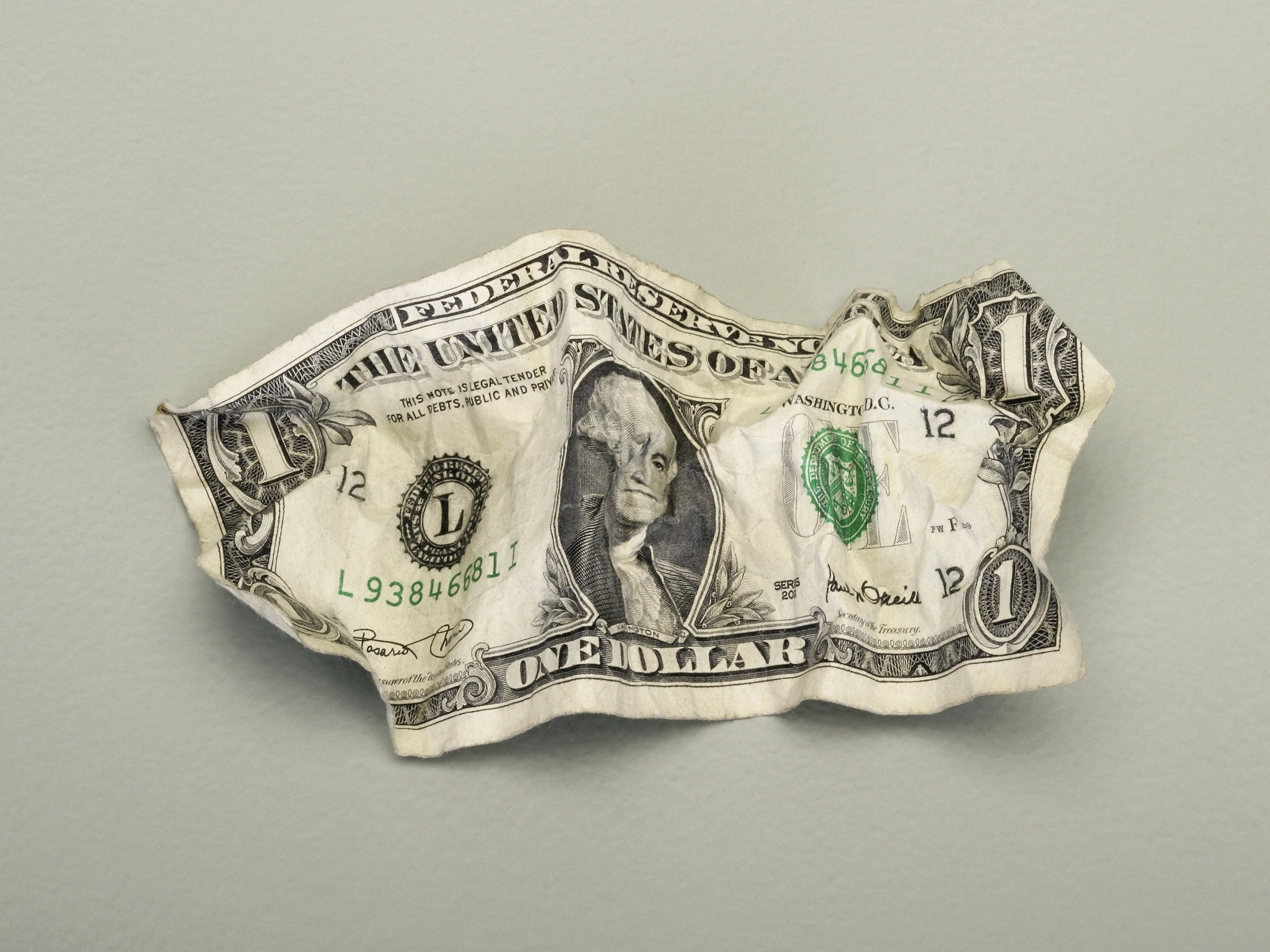 Crumpled-up $1 bill