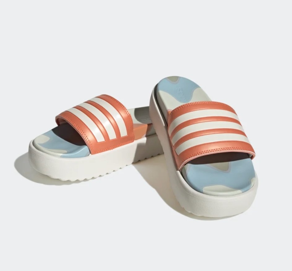 A pair of blue white and orange slides