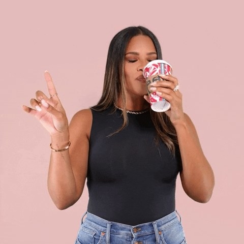 Woman taking a sip from a coffee cup