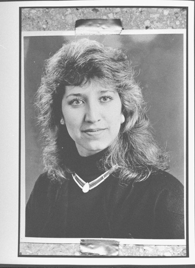 photo portrait of Sarah with shaggy hair, and a black turtle neck