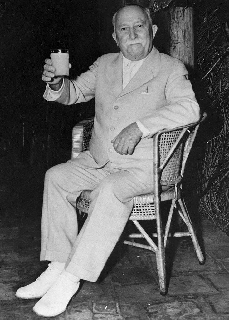 John Harvey Kellogg with a drink