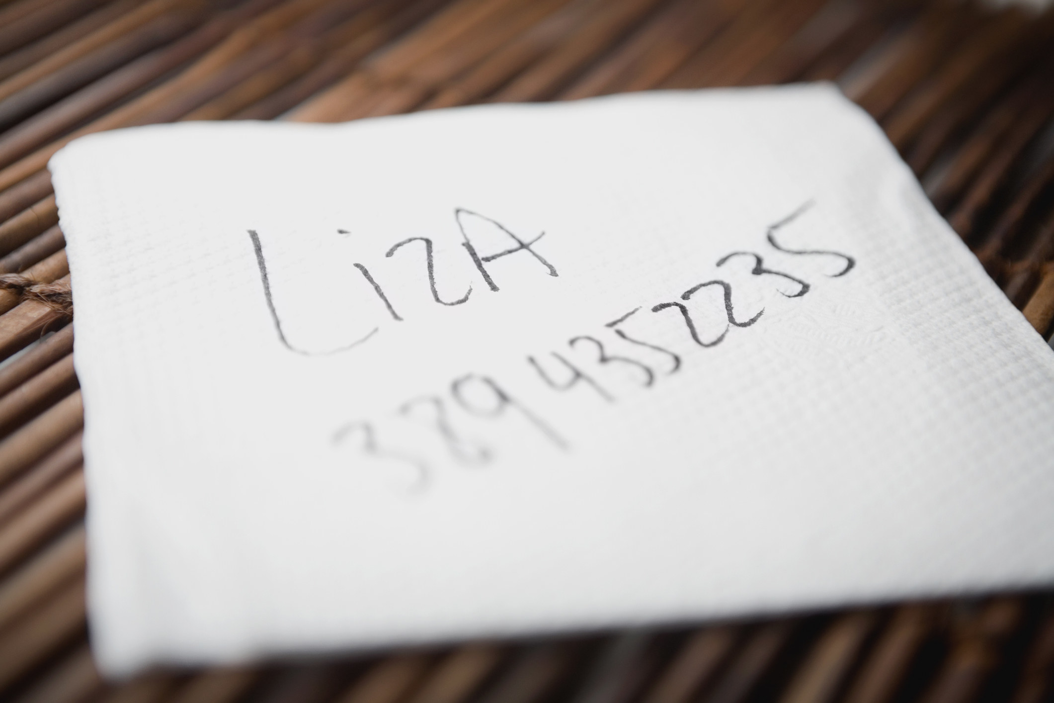 number and name written on a napkin