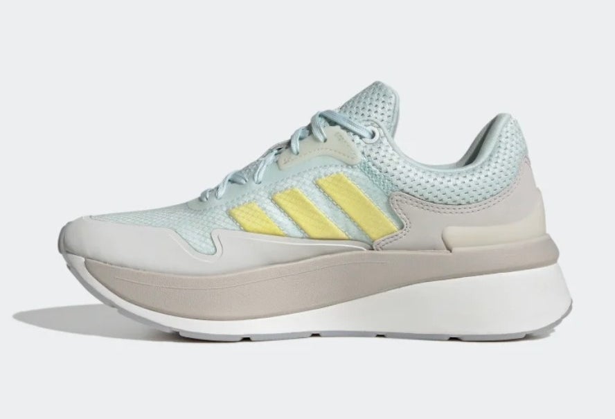 A light blue grey and yellow sneaker