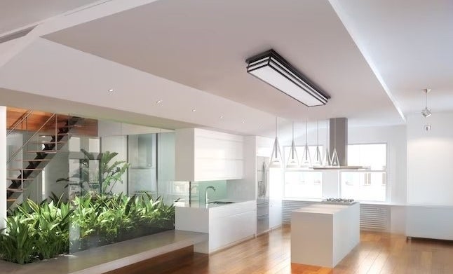 a black and white LED light on a kitchen ceiling and above a kitchen island