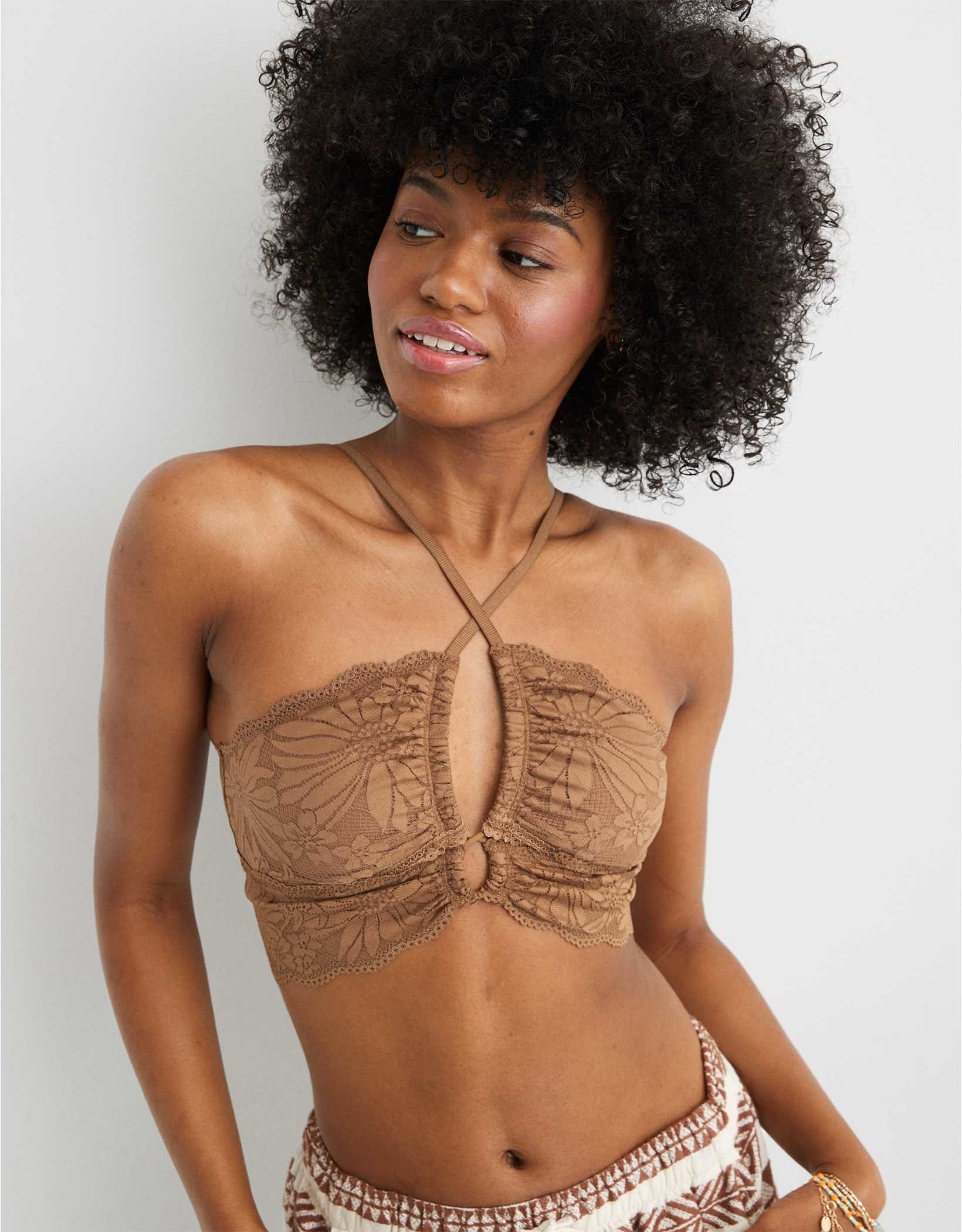 model in brown halter lace bratette with crossed straps and a keyhole cut-out